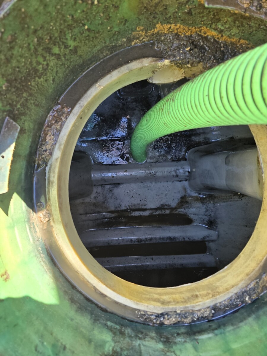 Lift station wet well pumping with vacuum hose by LINS Septic Corp in South Florida