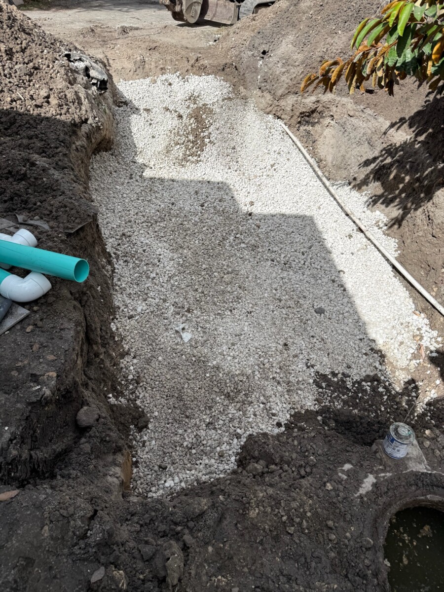 Drainfield excavation work using heavy equipment by LINS Septic Corp in Miami-Dade County